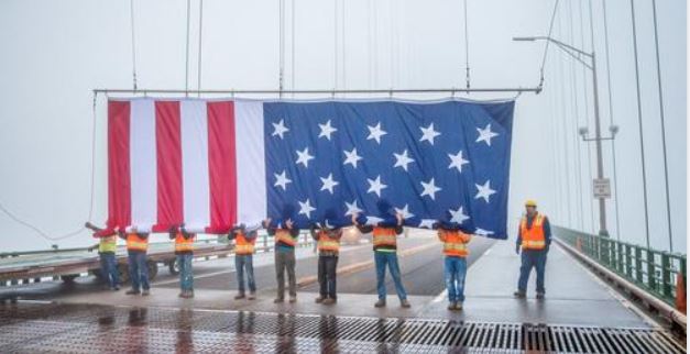 Giant American flag to hang from Mackinac Bridge via “ingenious” new reel system